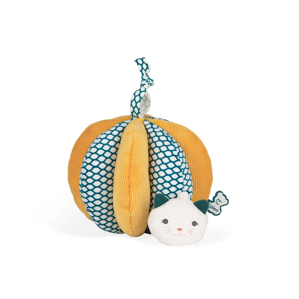 Balle de préhension Kaloo jaune et bleue avec tête de chat blanc en tissu doux