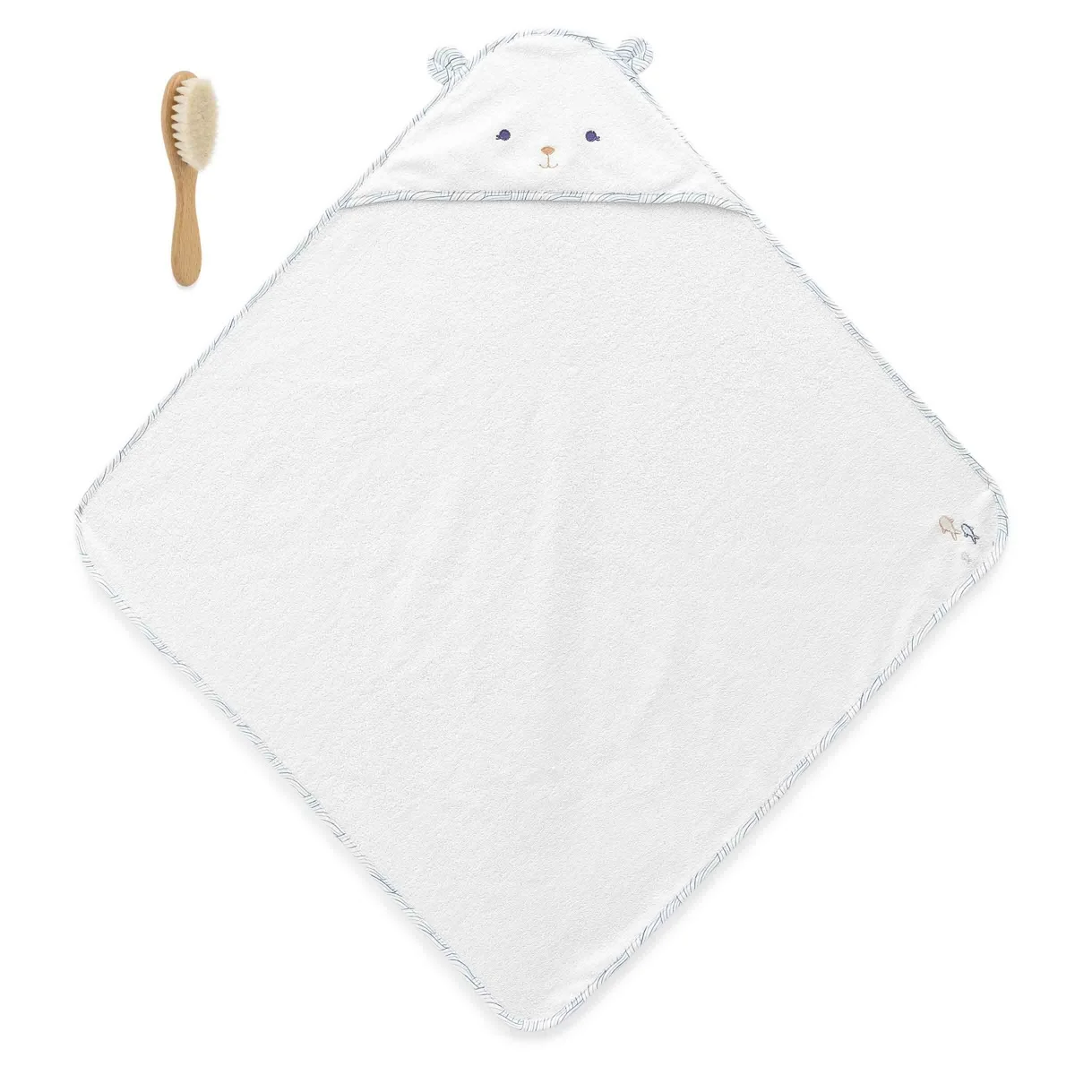 Cape de bain blanche Kaloo avec capuche ours et brosse à cheveux en bois naturel.