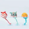 Trois balles de bain Joe Lilliputiens, renard rouge, éléphant vert, et poisson jaune flottant.