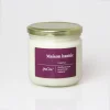 Bougie Maison hantée YesCire en verre blanc, couvercle doré, étiquette violette.