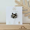 Broche en feutrine chat pailleté noir et doré motif léopard sur carton blanc.