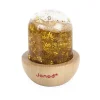 Bulle sensorielle jaune avec paillettes étoiles or, base bois Janod