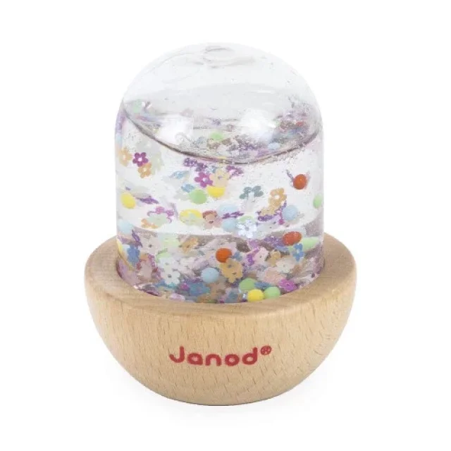Bulle sensorielle Janod avec confettis multicolores en forme de fleurs, base bois clair.