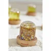 Bulle sensorielle Janod avec paillettes dorées et étoiles, base bois clair.
