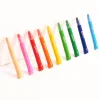 Crayons gel OMY alignés, couleurs variées avec capuchons transparents, corps plastique coloré.