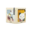 Cube sensoriel Kaloo jaune avec visage de chat brodé et feuilles colorées, emballage beige.