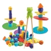 Jeu dextérité Totem Zen Djeco avec perles colorées, étoiles, base ronde et baguettes en bois.