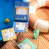 Jeu magnétique Sudokid avec planches colorées et jetons animaux sur nappe à carreaux.