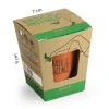 Boîte carton beige et verte Basilic Instinct avec pot en terre cuite visible