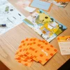 Cartes orange à motifs pommes rouges du jeu Le mystère des goûts Sucré/salé Acide/amer de Gigamic.