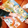 Cartes colorées illustrées avec scènes de marché et personnages, jeu Gigamic Le mystère des goûts