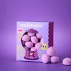 Mini billes de bain effervescentes violettes Berry Bloom Nailmatic, boîte carrée.