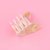Mini pince à cheveux nacrée en forme de coquillage avec lignes dorées