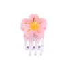 Mini pince à cheveux transparente avec fleur Sakura rose et centre jaune Coucou Suzette