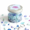 Pot transparent rempli de perles bleues, mauves et formes flocon Frozen