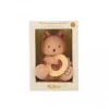 Peluche écureuil beige tenant un anneau de dentition jaune Kaloo, emballage crème.