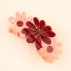 Pince à cheveux trio fleurs roses en résine translucide avec détails dorés