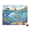 Puzzle 100 pièces Janod, scène sous-marine colorée avec baleine, pieuvre, plongeurs et bateaux.