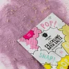 Sel de bain crépitant rose en grains avec sachet blanc coloré Nailmatic Kids.