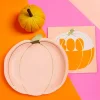 Serviettes d'Halloween en papier rose en forme de citrouille avec relief doré et nappe rose orange