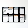 Tableau magnétique Ferflex noir avec cases hebdomadaires colorées et notes manuscrites